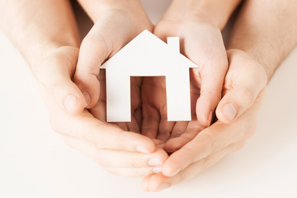 house in hands depicting hvac maintenance plans