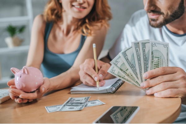 image of a couple setting aside money early for winter heating oil delivery