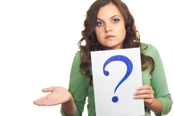 woman holding a question mark sign depicting asking what happens when your furnace runs out of heating oil