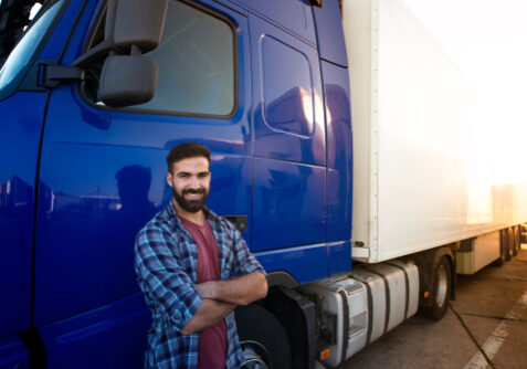 Professional,Truck,Driver,With,Crossed,Arms,Standing,By,His,Semi