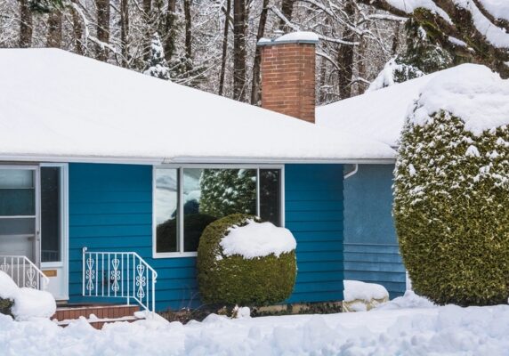 image of a house after a heavy snowfall